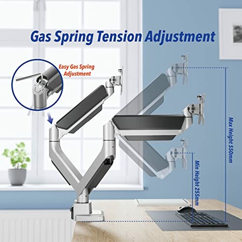 Adjustable gas spring monitor arm with desk setup.