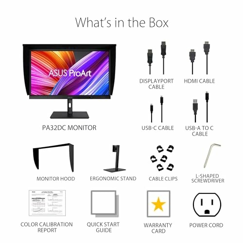 Contents of ASUS ProArt monitor box including cables, stand, and accessories.