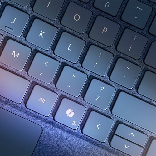 Close-up view of a laptop keyboard with blue lighting.