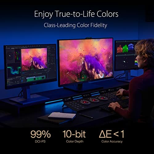 Person working at a multi-monitor setup showcasing color accuracy features.