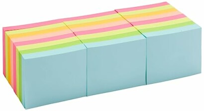 Stack of colorful sticky notes in blue, pink, green, and yellow.