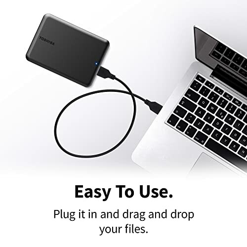 External hard drive connected to a laptop with text 'Easy To Use. Plug it in and drag and drop your files.'