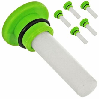 Set of green wine bottle stoppers with silicone seal.