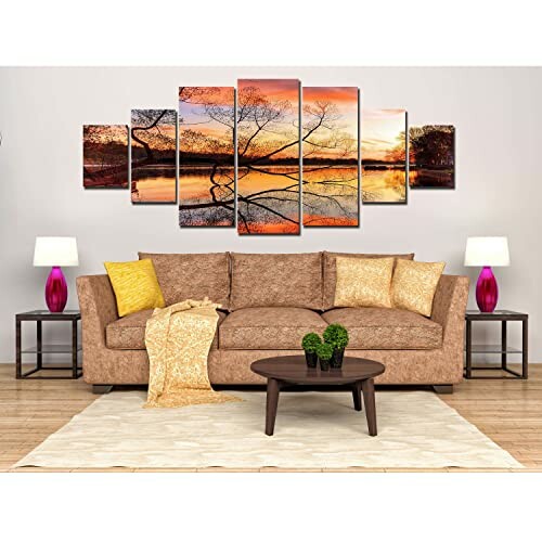 Living room with brown sofa, decorative pillows, and multi-panel wall art of a sunset over a lake