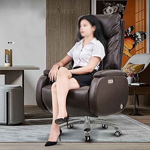 Person sitting on a brown office chair in a modern room.