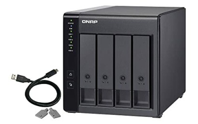 QNAP NAS storage device with cable and keys