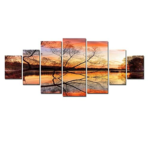 Multi-panel wall art depicting a sunset over a lake with tree reflections