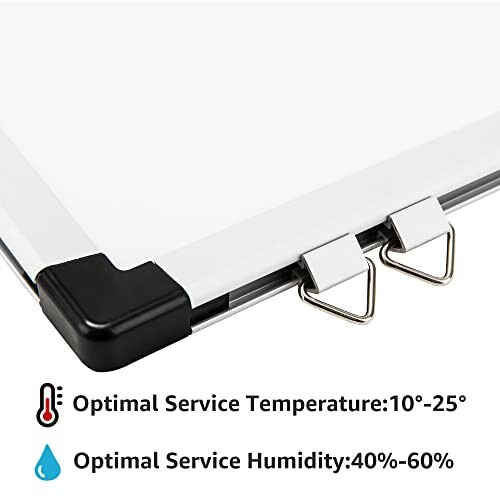 Close-up of whiteboard corner with hooks and optimal service temperature and humidity.