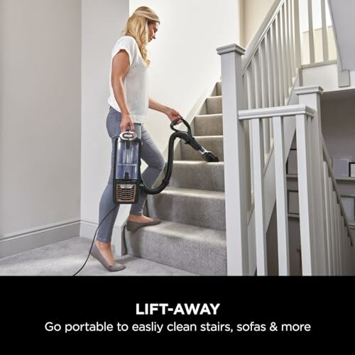 Woman cleaning stairs with a portable vacuum cleaner.