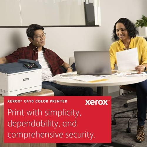 Two people working with a Xerox C410 color printer and laptop.